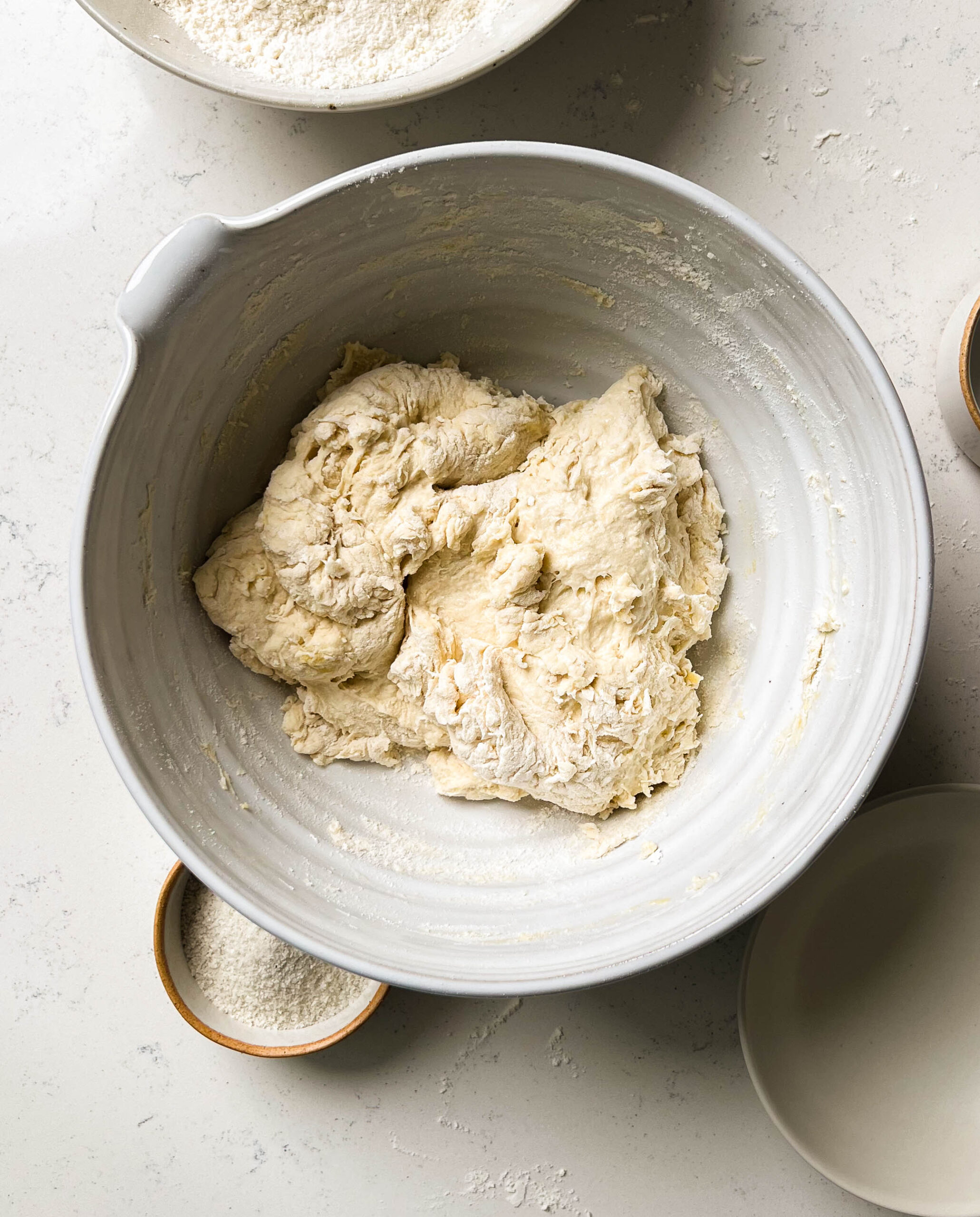 focaccia dough in a ceramic bowl