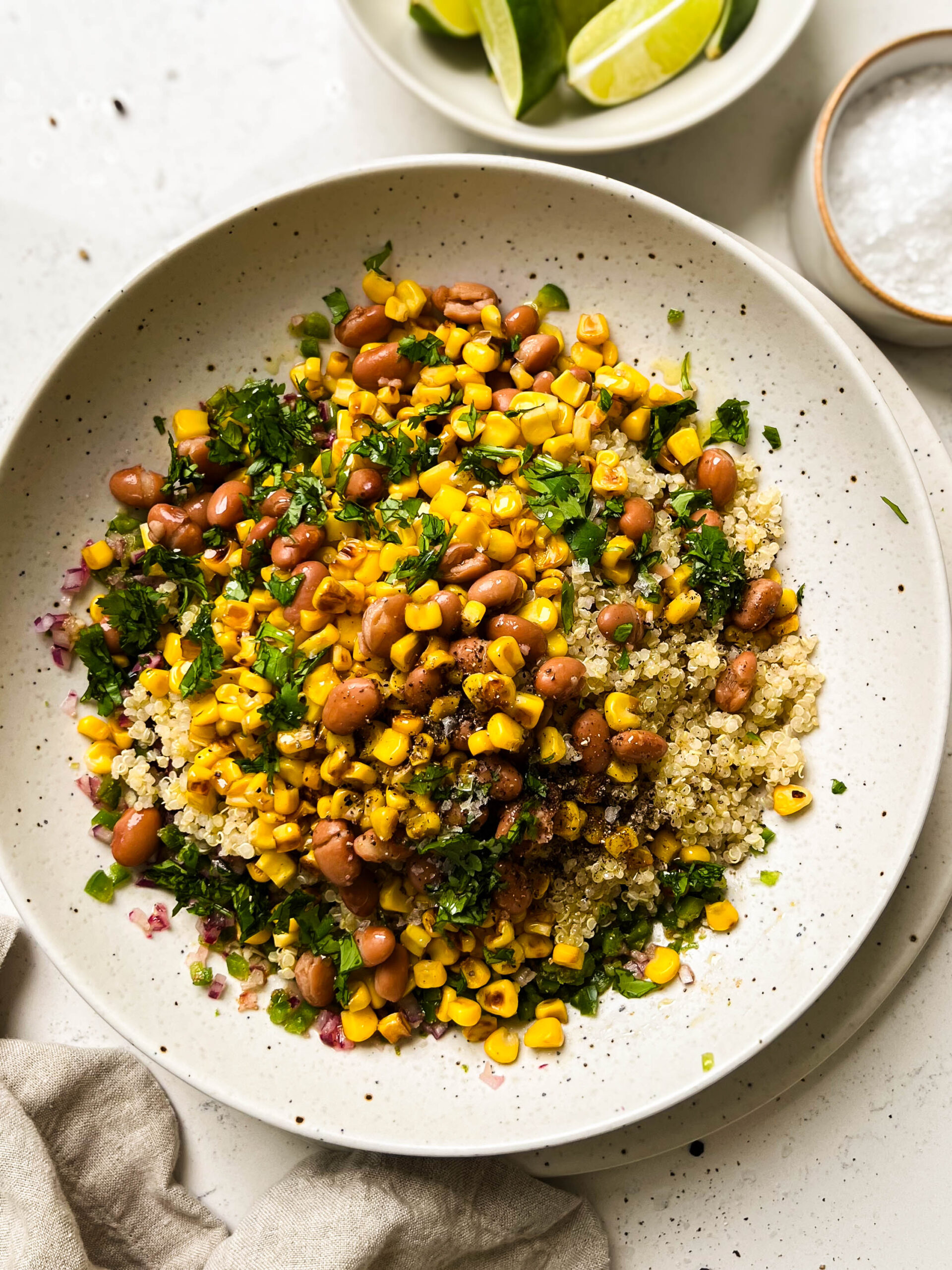 charred corn salad in a beige bowl