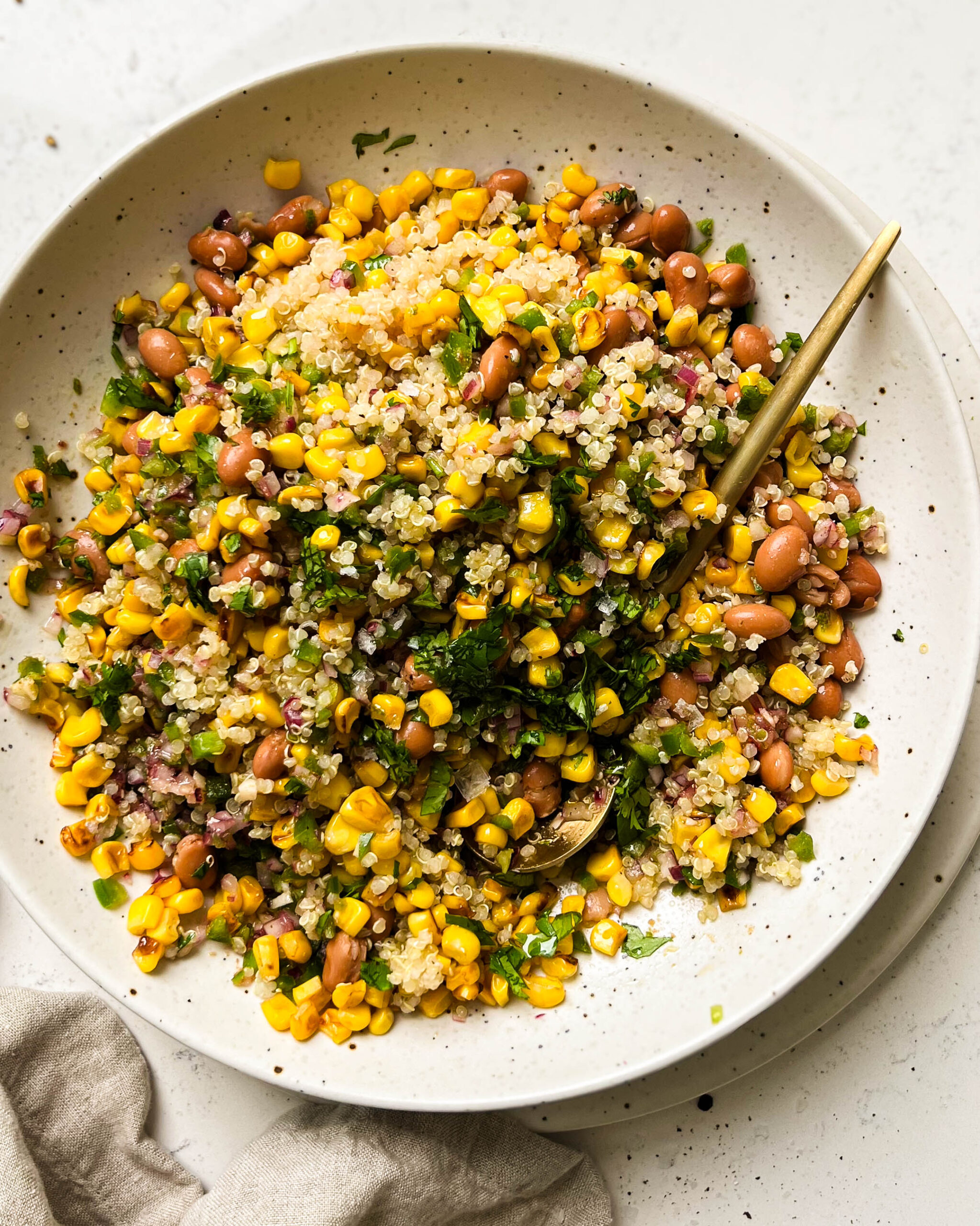 charred corn salad in a beige bowl