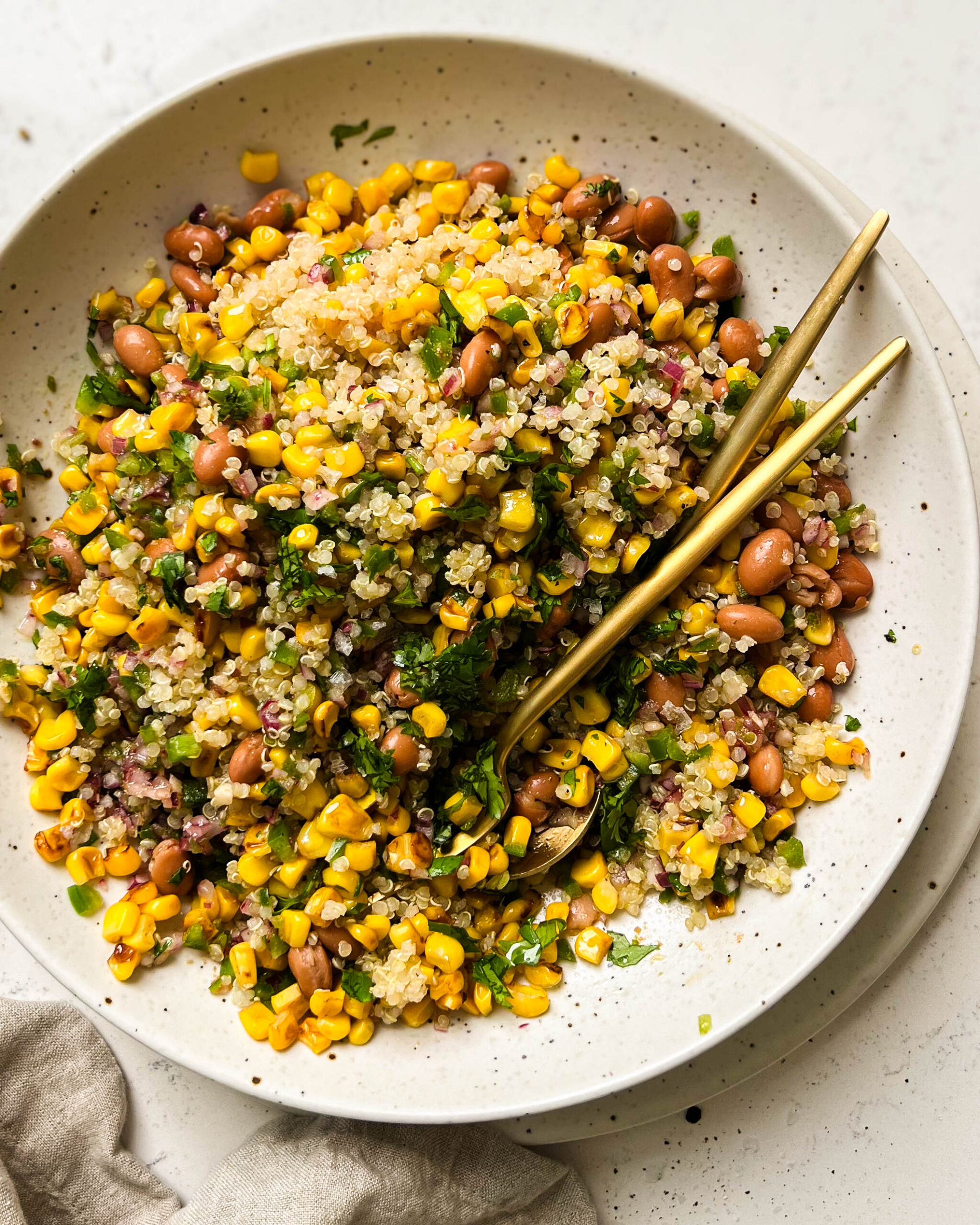 charred corn salad in a beige bowl