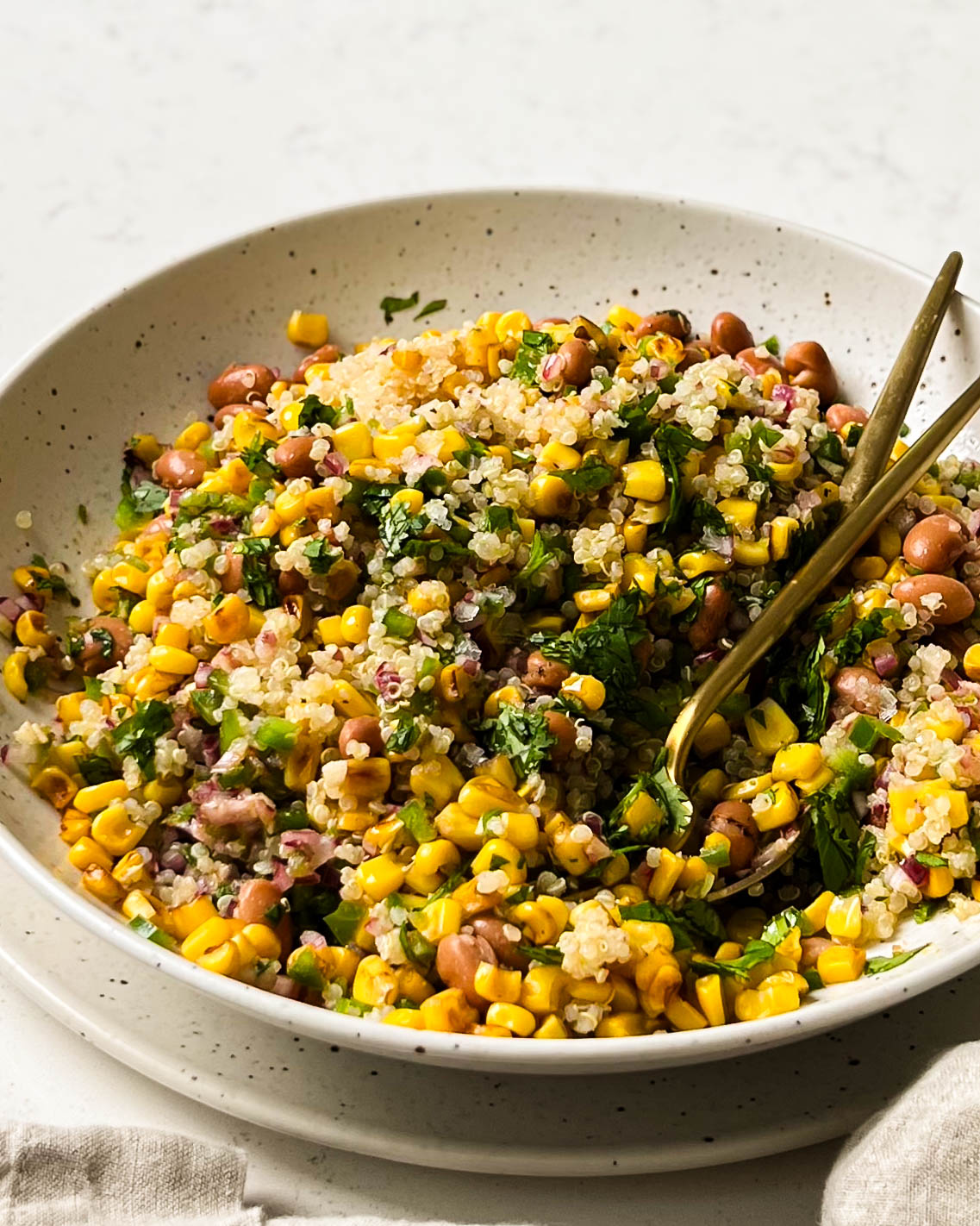 charred corn salad in a beige bowl