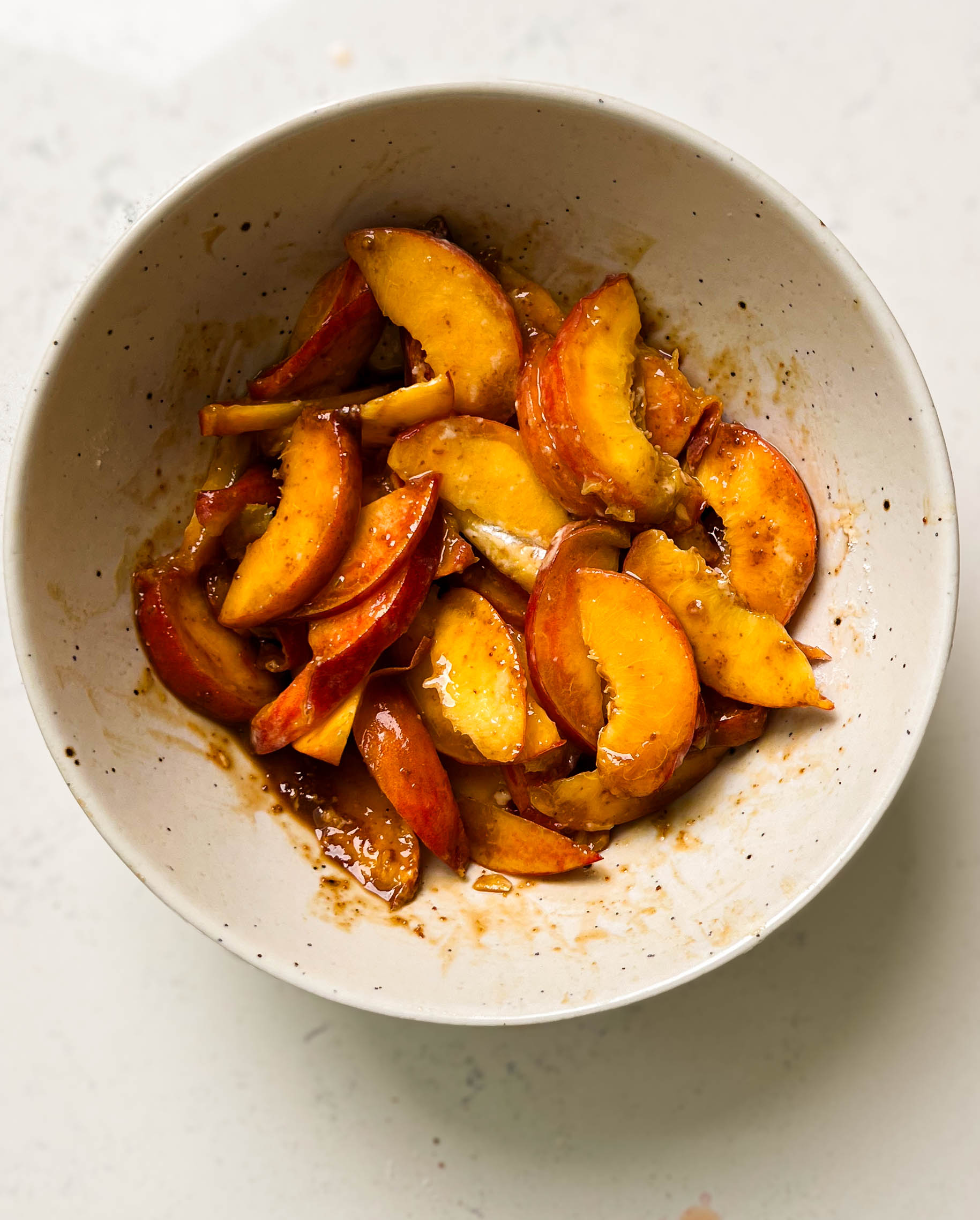 sliced peaches in a bowl