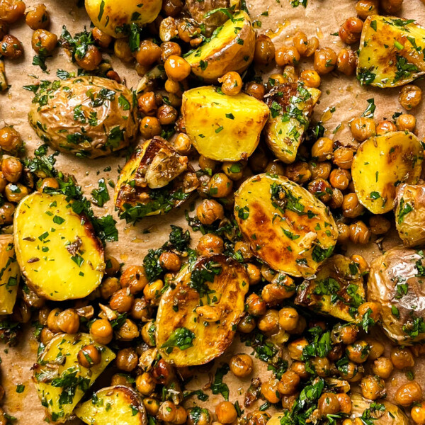 roasted potatoes and chickpeas on a gold pan