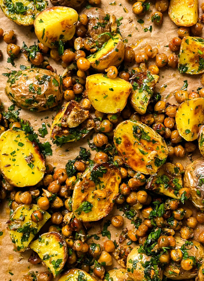 roasted potatoes and chickpeas on a gold pan