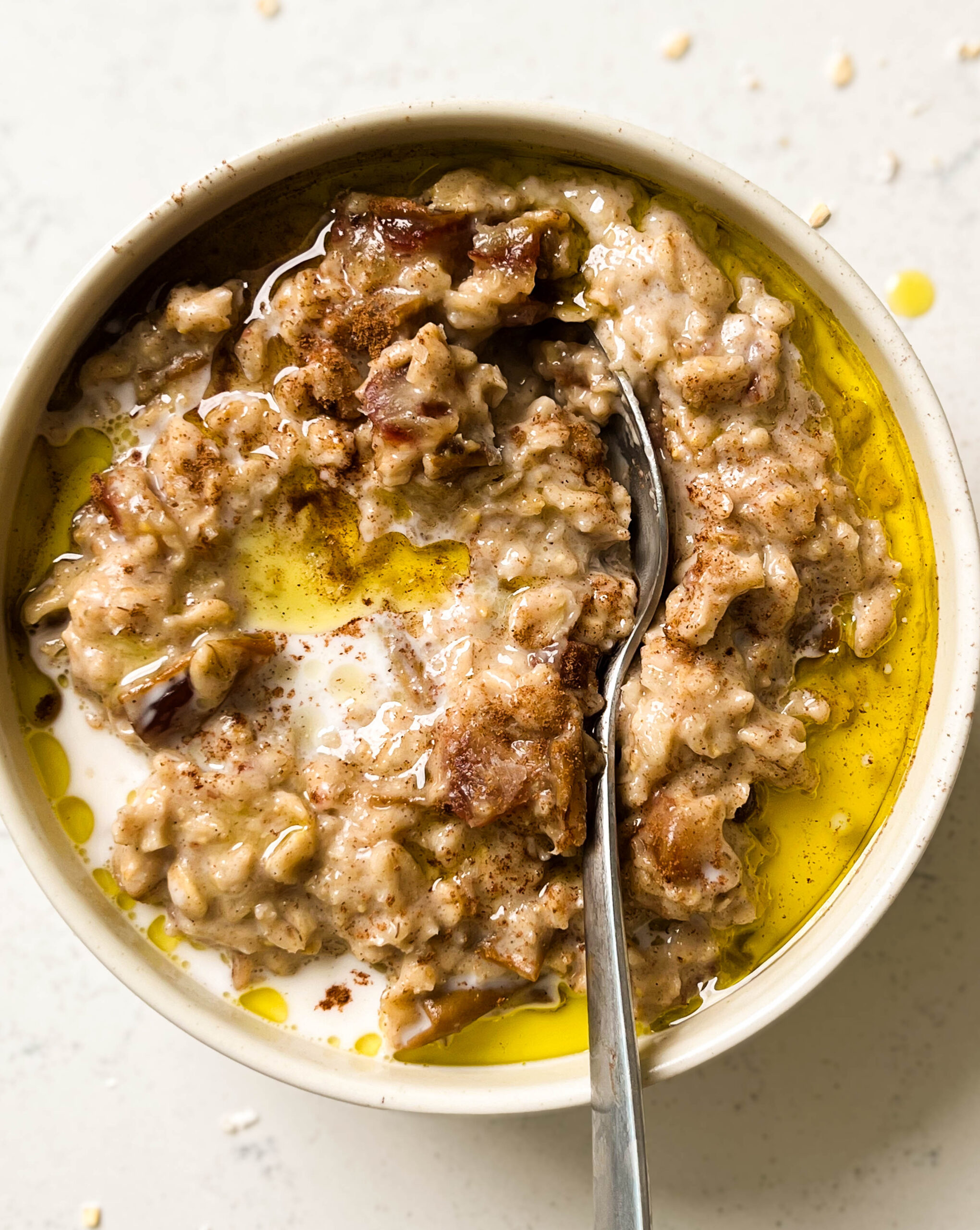 date oatmeal in a bowl with olive oil on top