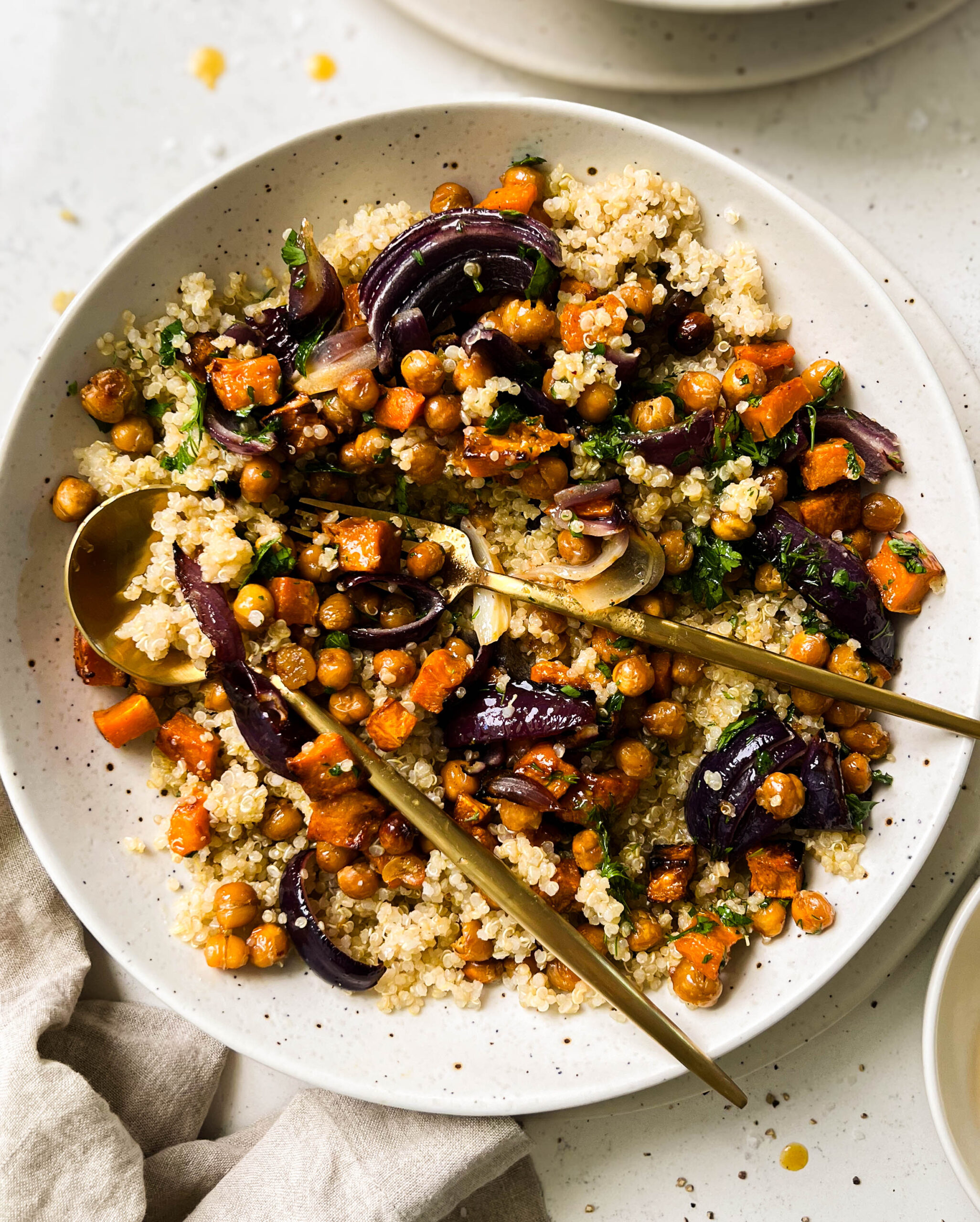 butternut squash salad in a speckled white bowl