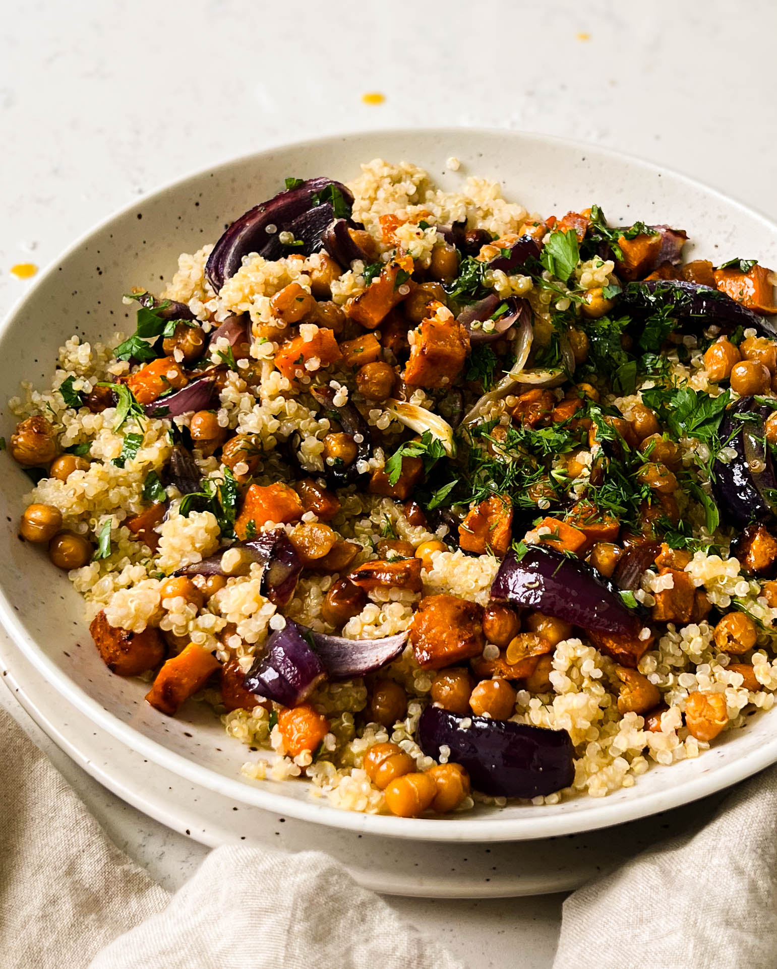 butternut squash salad in a speckled white bowl