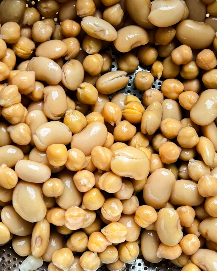 butter beans and garbanzo beans in a colander