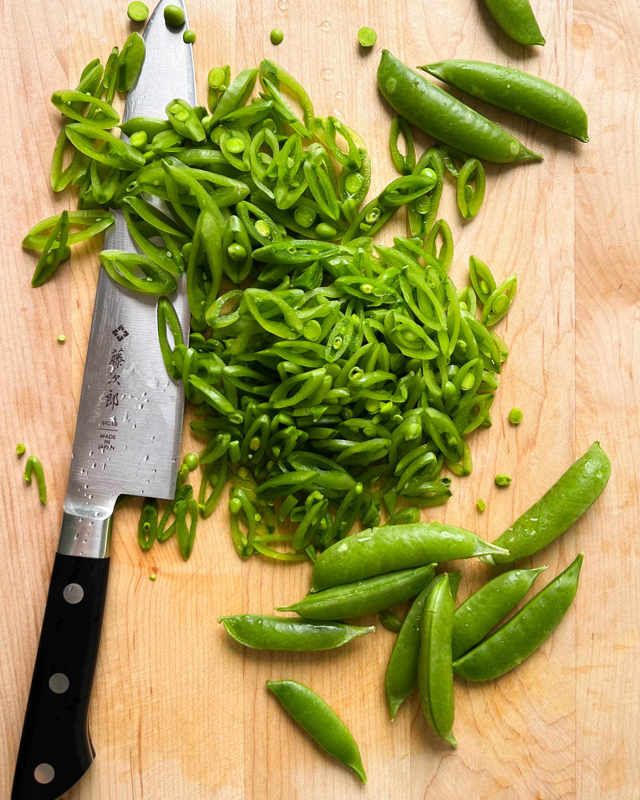 snap pea on a cutting board