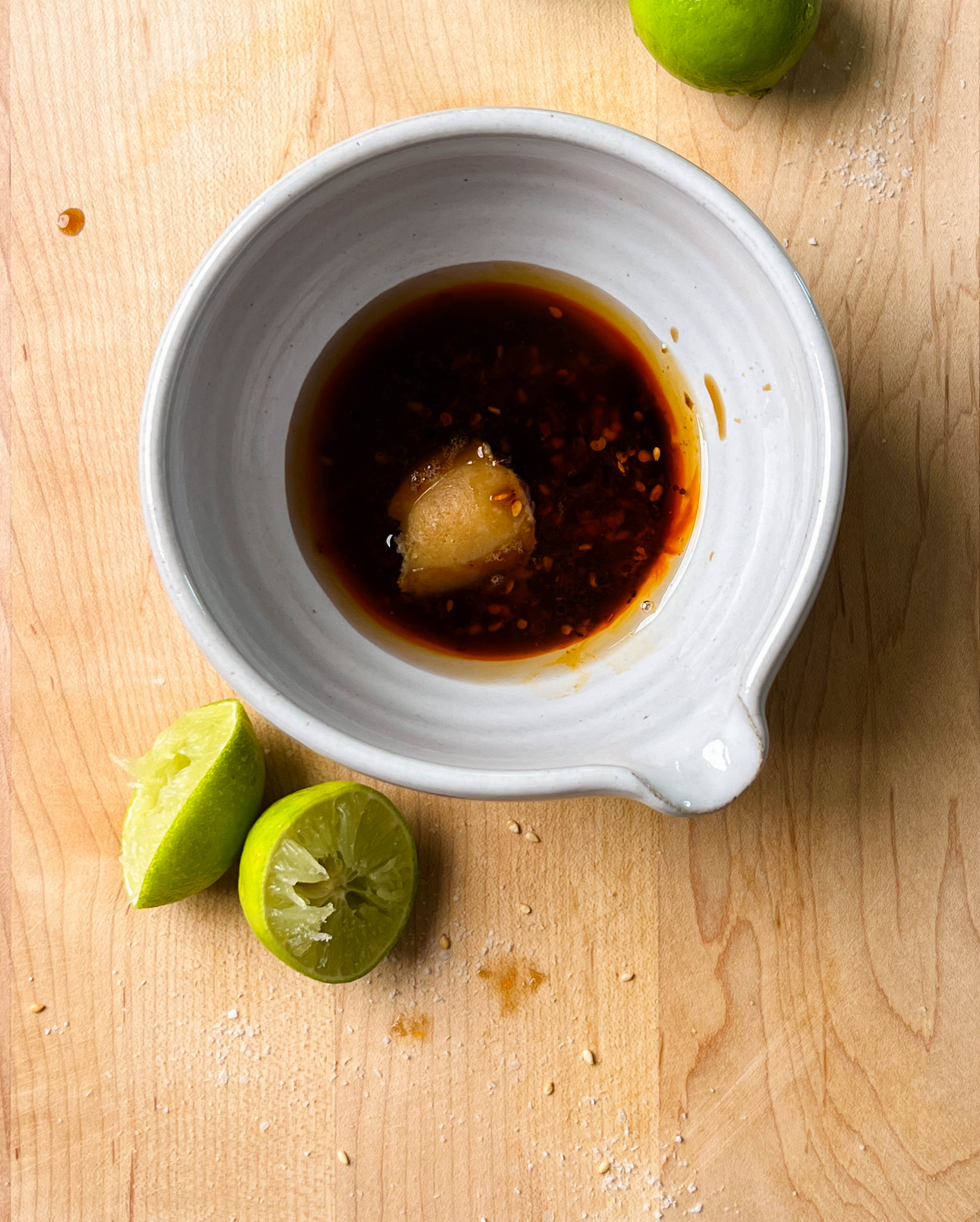 chili crisp lime sauce in a white bowl