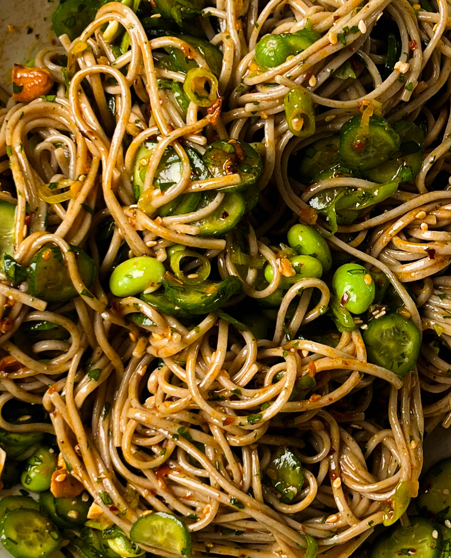 cucumber soba noodle salad in a white bowl