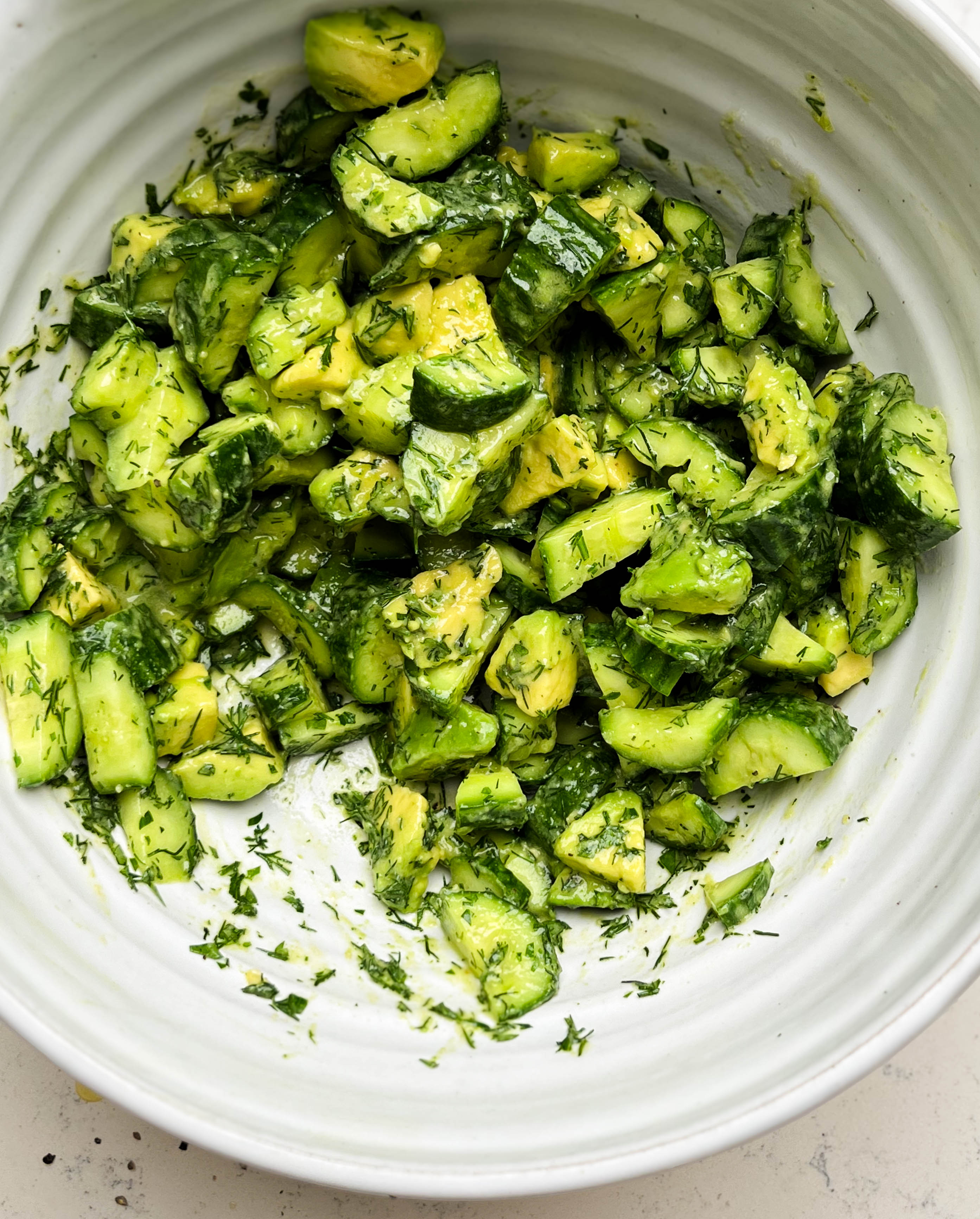 smashed cucumber avocado salad in a bowl